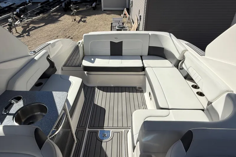 Slide: The Image of 2016 Chaparral 307 SSX boat interior with luxurious seating and built-in sink. - 39