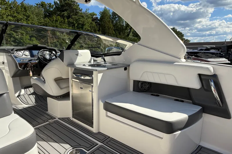 Slide: The Image of 2016 Chaparral 307 SSX boat interior with luxurious seating and modern dashboard. - 43