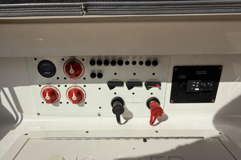 Slide: The Image of Control panel of a 2016 Chaparral 307 SSX boat with switches and dials. - 49
