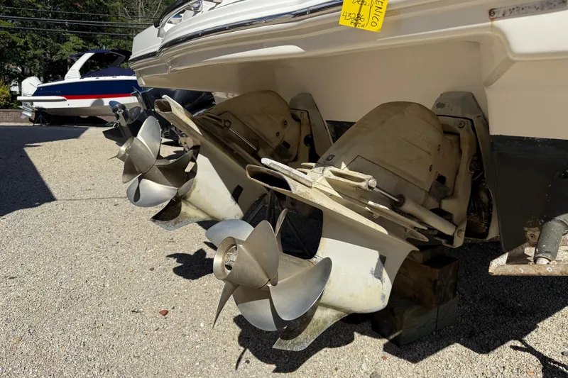 Slide: The Image of 2016 Chaparral 307 SSX boat propellers on display in a sunny outdoor setting. - 7