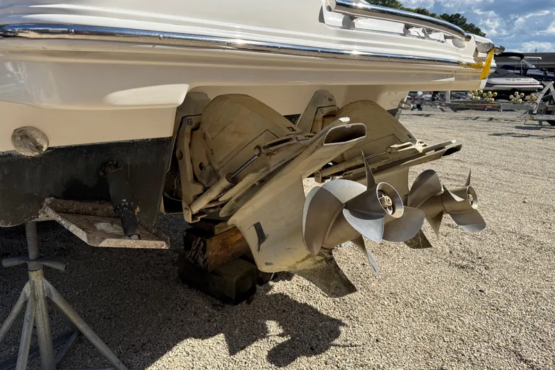 Slide: The Image of Rear view of 2016 Chaparral 307 SSX boat with dual propellers on dry land. - 8
