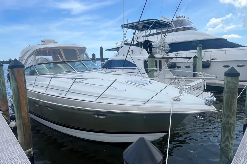 The Image of 2012 Formula 34 Performance Cruiser docked at marina under clear blue sky. - 1