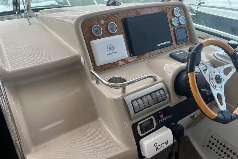 Slide: The Image of 2012 Formula 34 Performance Cruiser helm with Raymarine electronics and wood-accented steering wheel. - 10