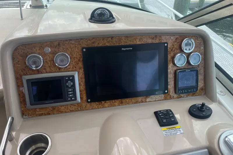 Slide: The Image of Control panel of a 2012 Formula 34 Performance Cruiser with navigation instruments. - 11