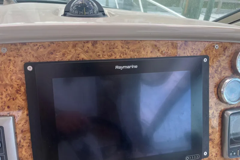 Slide: The Image of Dashboard of 2012 Formula 34 Performance Cruiser with Raymarine display and compass. - 12