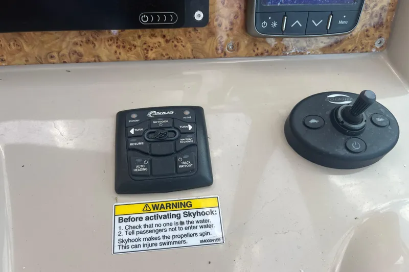 Slide: The Image of Control panel of a 2012 Formula 34 Performance Cruiser with joystick and warning label. - 14