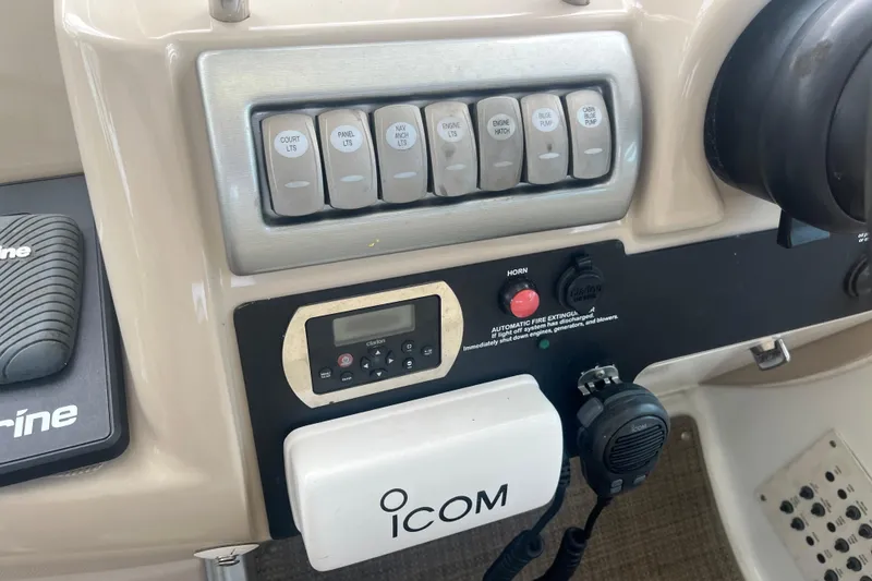 Slide: The Image of Control panel of a 2012 Formula 34 Performance Cruiser with Icom radio and switches. - 18