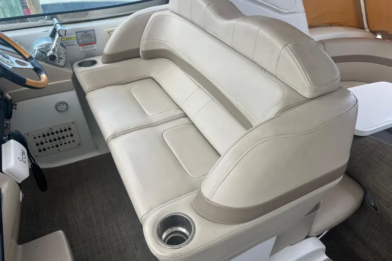 Slide: The Image of 2012 Formula 34 Performance Cruiser interior with beige seating and steering wheel. - 21