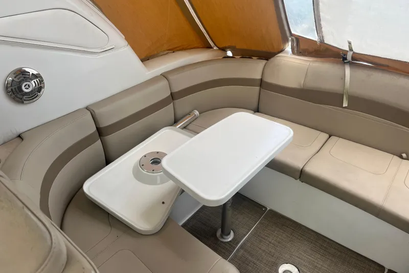 Slide: The Image of 2012 Formula 34 Performance Cruiser interior with beige seating and a white table. - 22