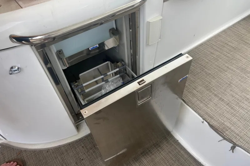 Slide: The Image of 2012 Formula 34 Performance Cruiser with open stainless steel storage compartment. - 23