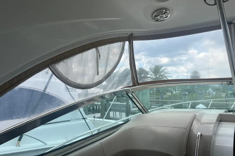 Slide: The Image of Interior view of a 2012 Formula 34 Performance Cruiser with marina backdrop. - 26