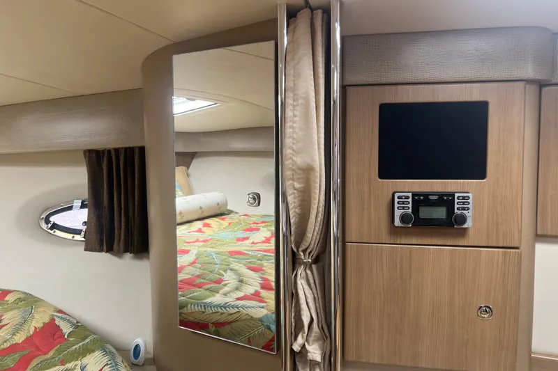 Slide: The Image of Interior of 2012 Formula 34 Performance Cruiser with mirror, bed, and entertainment system. - 36