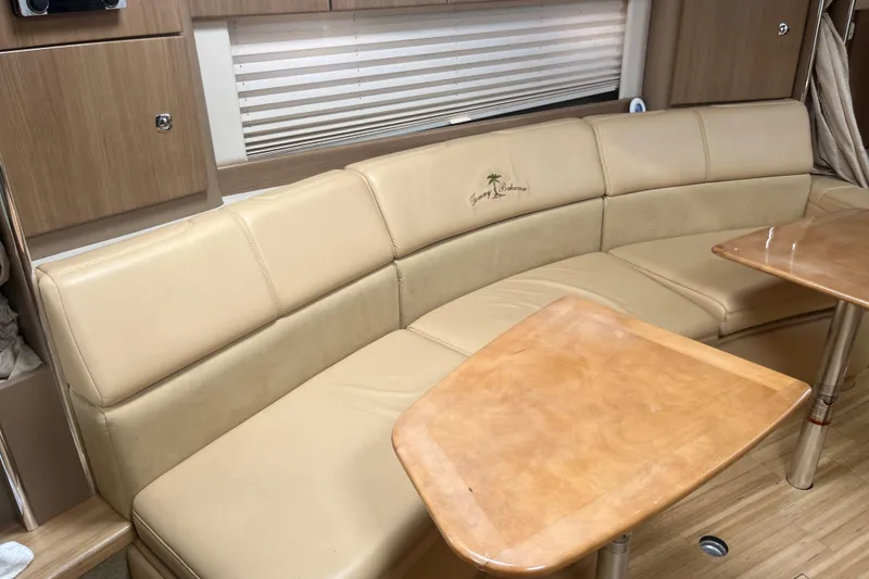 Slide: The Image of Luxurious interior of 2012 Formula 34 Performance Cruiser with beige leather seating and wooden table. - 37