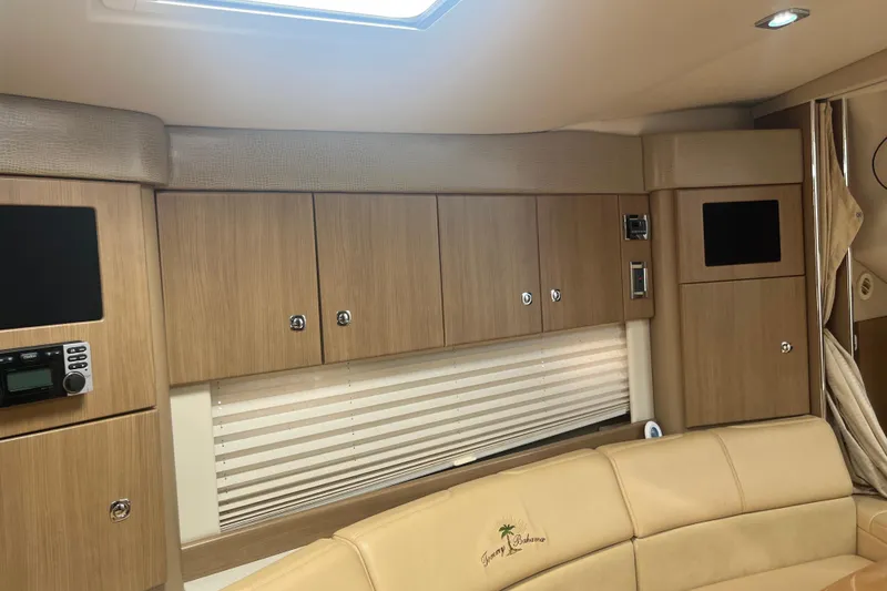 Slide: The Image of Interior of 2012 Formula 34 Performance Cruiser with wood cabinets and beige seating. - 38