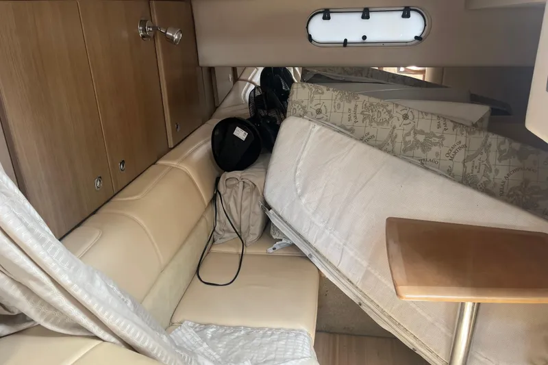 Slide: The Image of Interior of a 2012 Formula 34 Performance Cruiser with beige seating and wooden accents. - 41