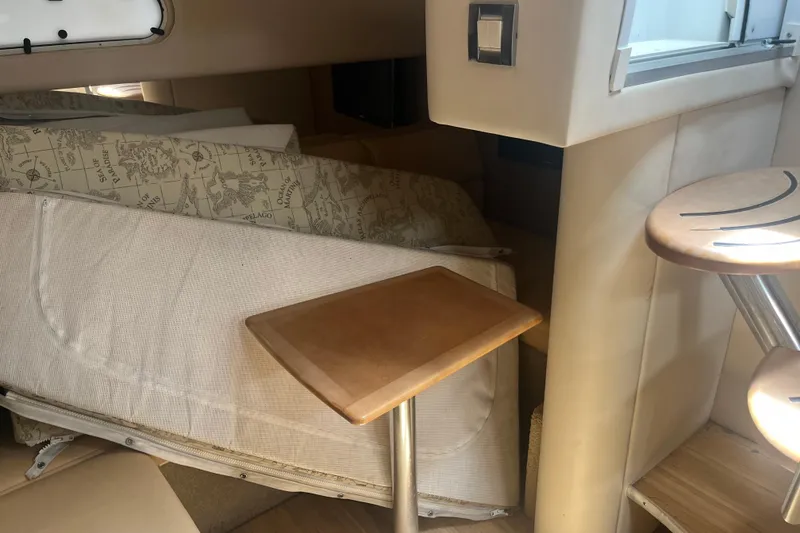 Slide: The Image of Interior of 2012 Formula 34 Performance Cruiser with beige seating and wooden table. - 42