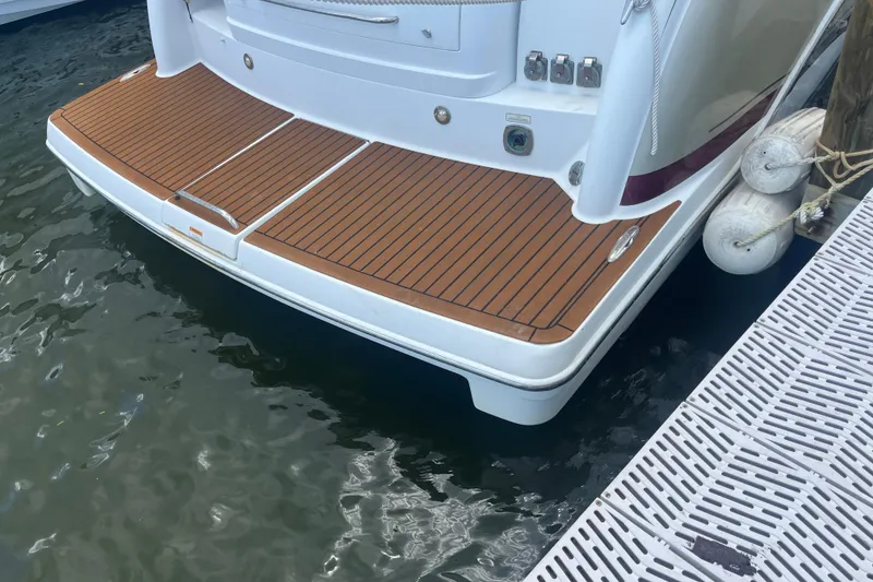 Slide: The Image of 2012 Formula 34 Performance Cruiser's teak swim platform at dockside. - 6