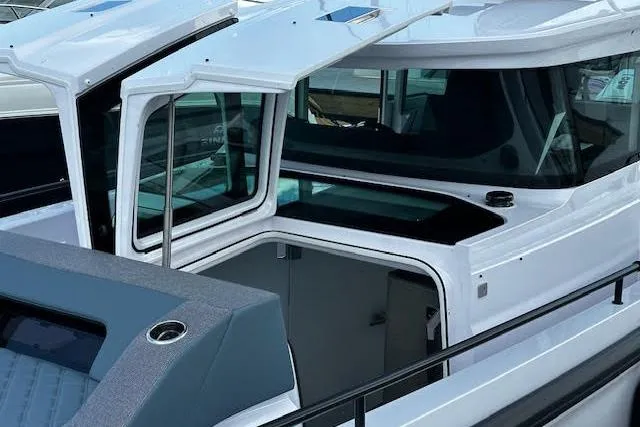 Slide: The Image of 2024 Axopar 37 XC Cross Cabin Wet Bar, featuring sleek design and open cabin layout. - 13