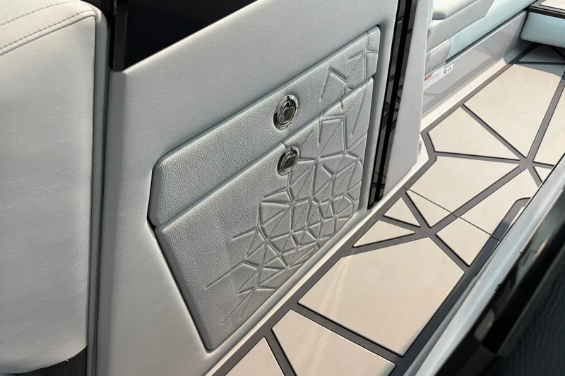 Slide: The Image of 2026 Nautique Super Air Nautique G25 Paragon interior with geometric design and sleek flooring. - 10