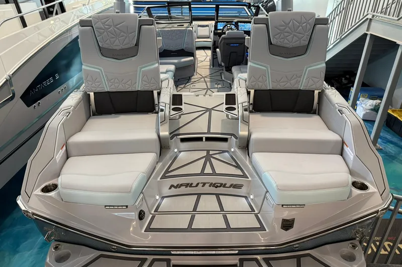 Slide: The Image of 2026 Nautique Super Air Nautique G25 Paragon luxury boat interior with plush seating. - 24