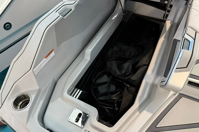Slide: The Image of Storage compartment of 2026 Nautique Super Air Nautique G25 Paragon boat. - 30