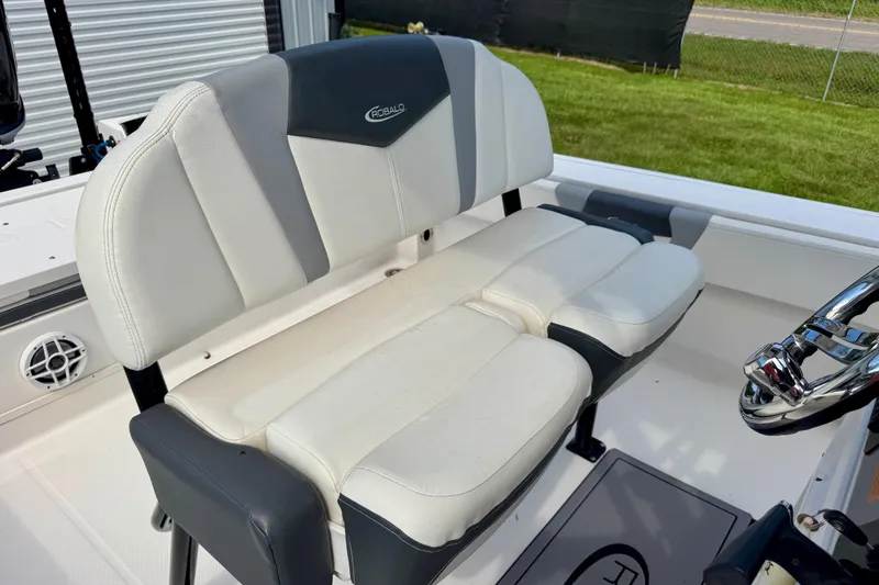 Slide: The Image of 2022 Robalo 266 Cayman boat seat with white and gray upholstery. - 16