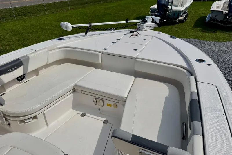 Slide: The Image of 2022 Robalo 266 Cayman boat interior with seating and storage compartments. - 6