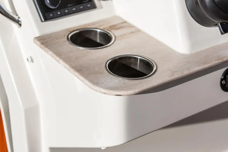 Slide: The Image of Steering wheel of 2024 Hinckley Sport Boat 40c, showcasing sleek design and controls. - 19