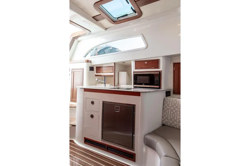 Slide: The Image of Luxurious interior of 2024 Hinckley Sport Boat 40c with elegant wood finishes. - 28