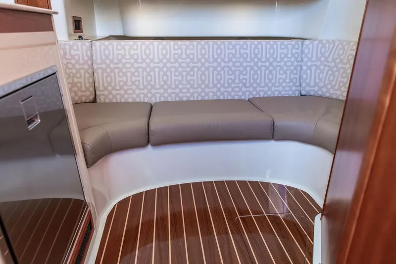 Slide: The Image of 2024 Hinckley Sport Boat 40c interior with skylight and wooden cabinetry. - 33