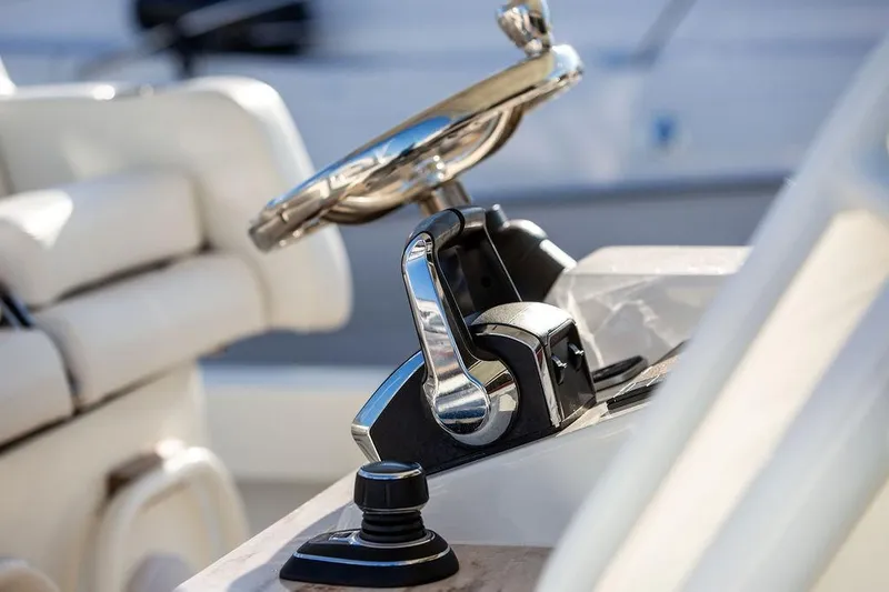 Slide: The Image of 2024 Hinckley Sport Boat 40c docked, showcasing sleek design and spacious deck. - 14