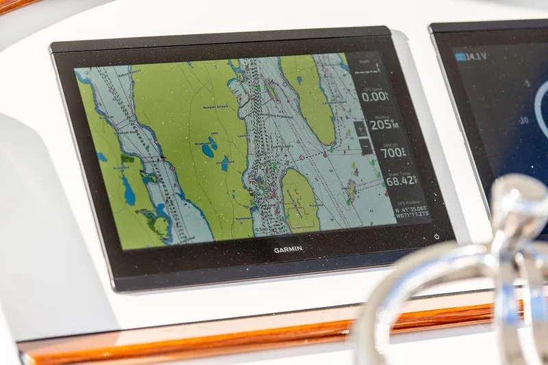 Slide: The Image of Steering wheel and controls of 2024 Hinckley Sport Boat 40c cockpit. - 17