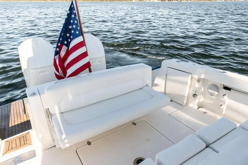 Slide: The Image of 2024 Hinckley Sport Boat 40c, featuring sleek deck design and modern outboard engines. - 23
