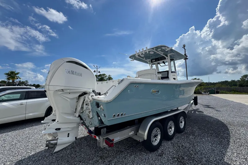 Slide: The Image of 2023 Sea Hunt Gamefish 30 Coffin Box boat with Yamaha engine on trailer. - 11