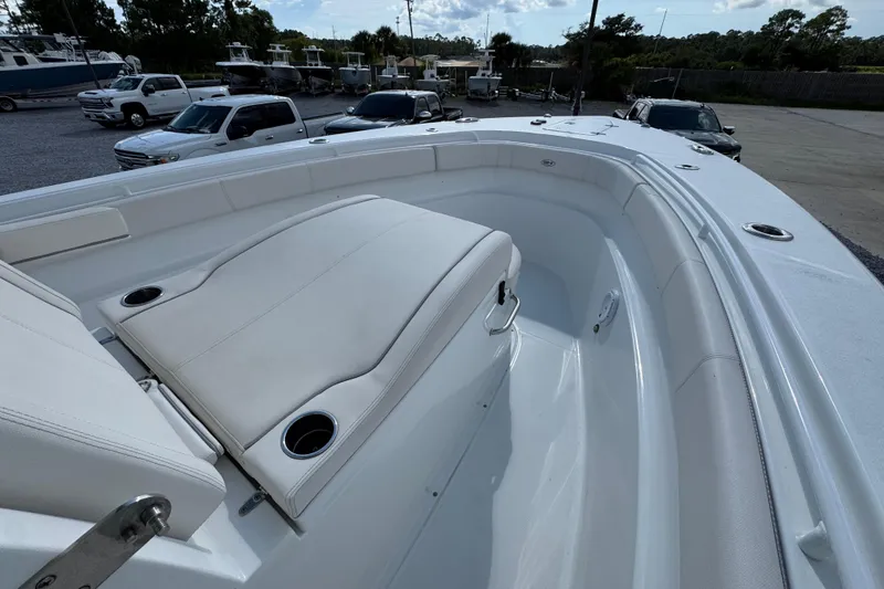 Slide: The Image of 2023 Sea Hunt Gamefish 30 Coffin Box boat interior with white seating and cup holders. - 17