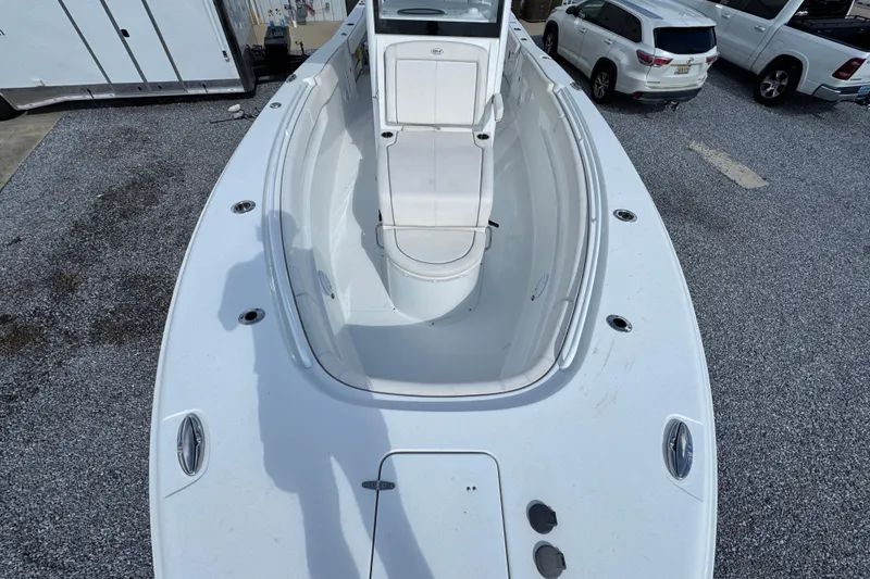 Slide: The Image of 2023 Sea Hunt Gamefish 30 Coffin Box boat, top view, parked on gravel. - 20