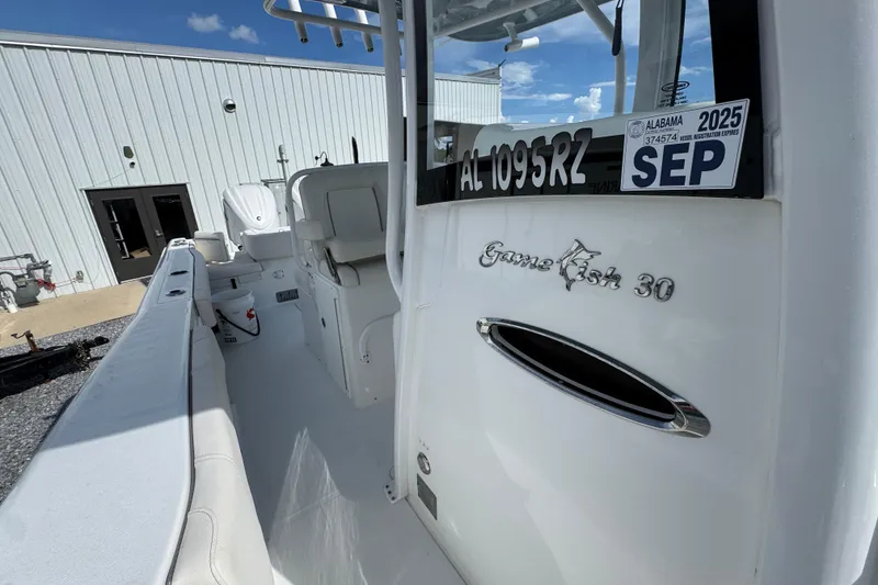 Slide: The Image of 2023 Sea Hunt Gamefish 30 Coffin Box boat interior with Alabama registration sticker. - 24