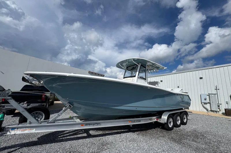 Slide: The Image of 2023 Sea Hunt Gamefish 30 Coffin Box boat on trailer under cloudy sky. - 3