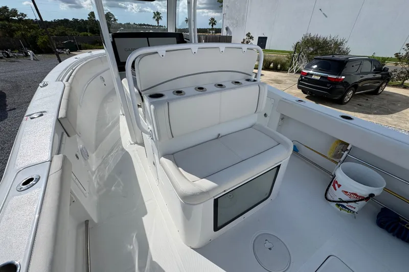 Slide: The Image of 2023 Sea Hunt Gamefish 30 Coffin Box boat interior with seating and storage. - 32