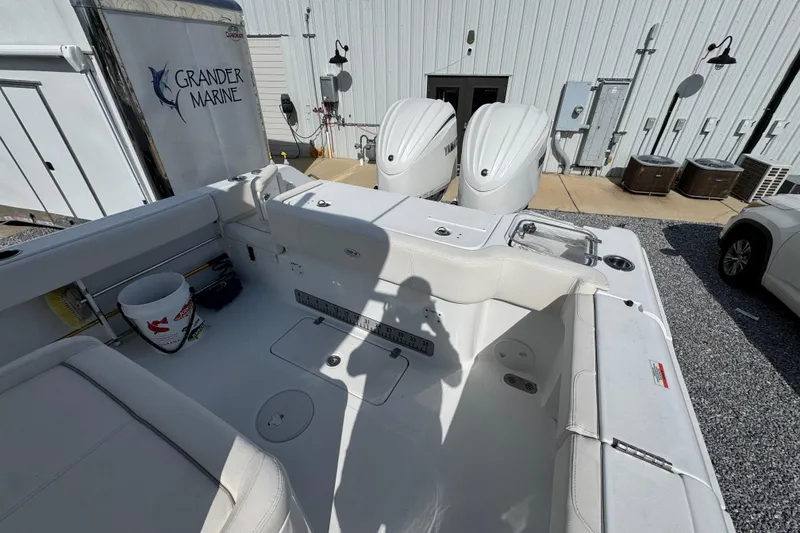 Slide: The Image of 2023 Sea Hunt Gamefish 30 Coffin Box boat interior with dual Yamaha engines at Grander Marine. - 34