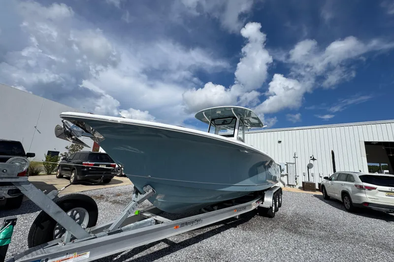 Slide: The Image of 2023 Sea Hunt Gamefish 30 Coffin Box boat on trailer under blue sky. - 4
