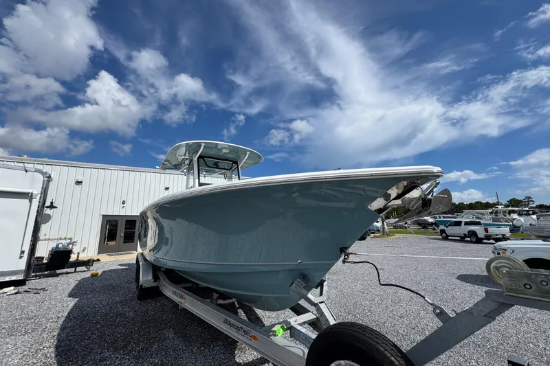 Slide: The Image of 2023 Sea Hunt Gamefish 30 Coffin Box boat on trailer under blue sky. - 7