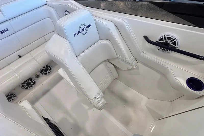 Slide: The Image of 2006 Fountain 42 Executioner boat interior with white seating and audio speakers. - 10
