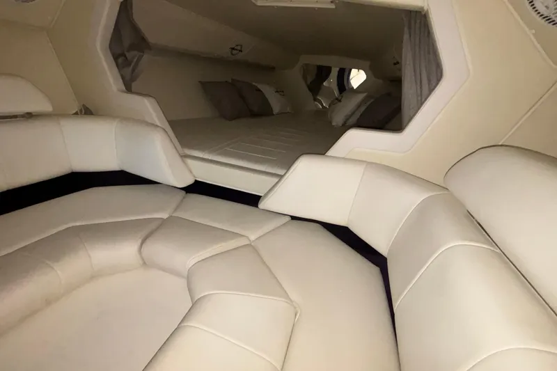 Slide: The Image of Interior of 2006 Fountain 42 Executioner boat with plush seating and sleeping area. - 16