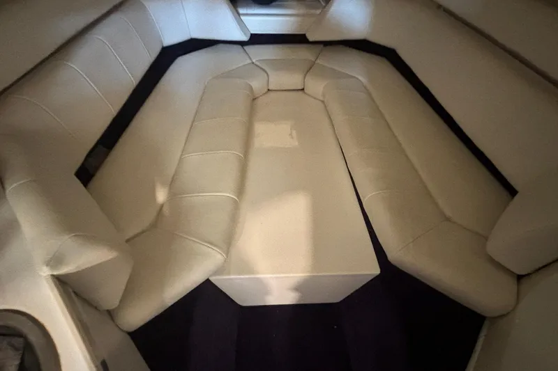 Slide: The Image of 2006 Fountain 42 Executioner cabin interior with beige seating and table. - 19