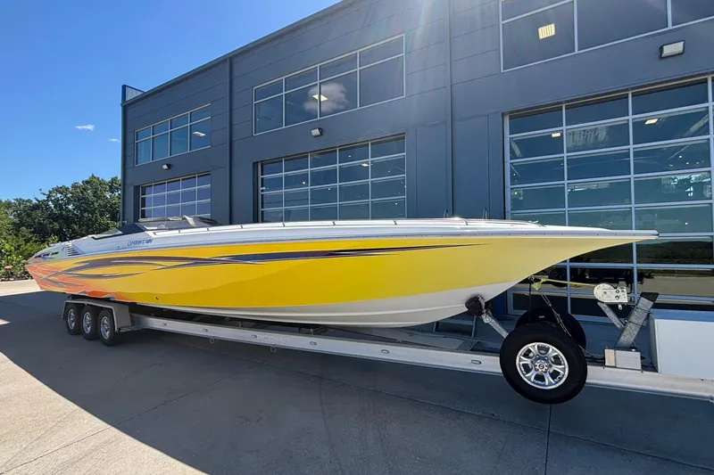 Slide: The Image of 2006 Fountain 42 Executioner speedboat with vibrant yellow design on a trailer. - 4