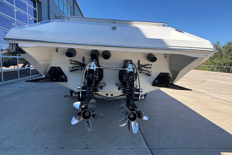 Slide: The Image of 2006 Fountain 42 Executioner boat with dual propellers, viewed from the rear on a sunny day. - 5