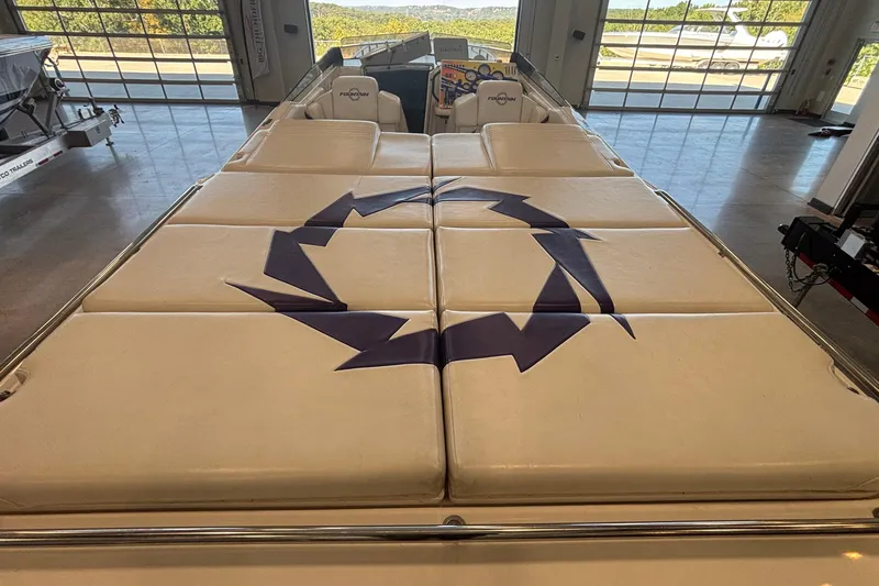 Slide: The Image of 2006 Fountain 42 Executioner boat interior with cushioned seating and logo design. - 7