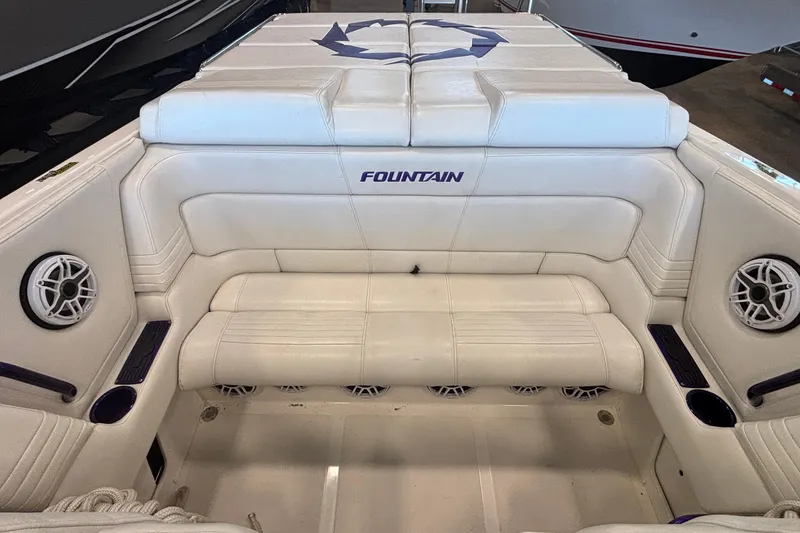 Slide: The Image of 2006 Fountain 42 Executioner boat interior with white seating and speaker system. - 8