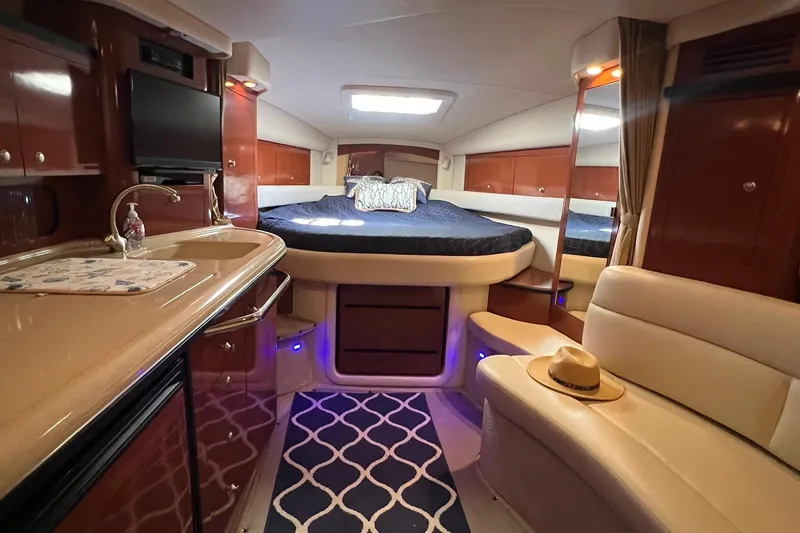 Slide: The Image of Luxurious interior of 2005 Sea Ray 340 Sundancer yacht with cozy bed and elegant furnishings. - 10